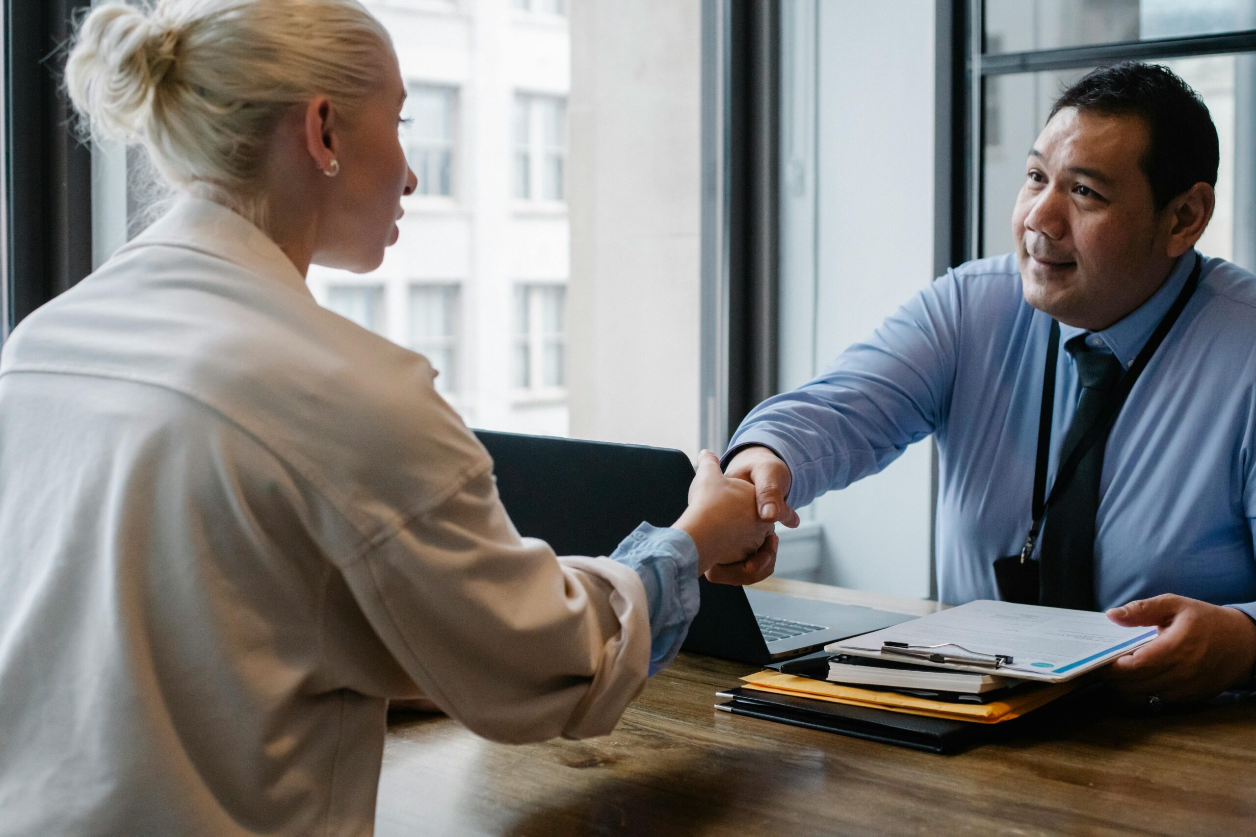 two people agreeing with a handshake on a business registration in Thailand