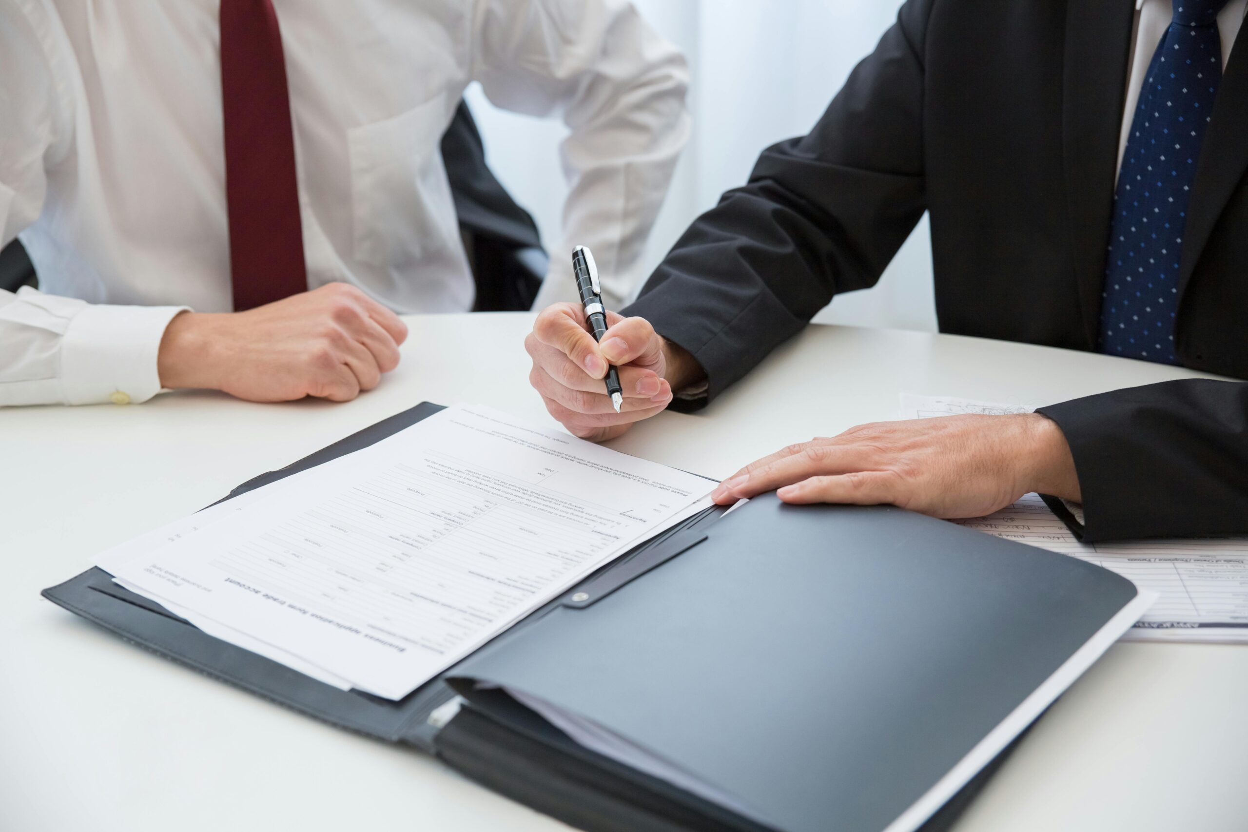 Two people setting up company registration