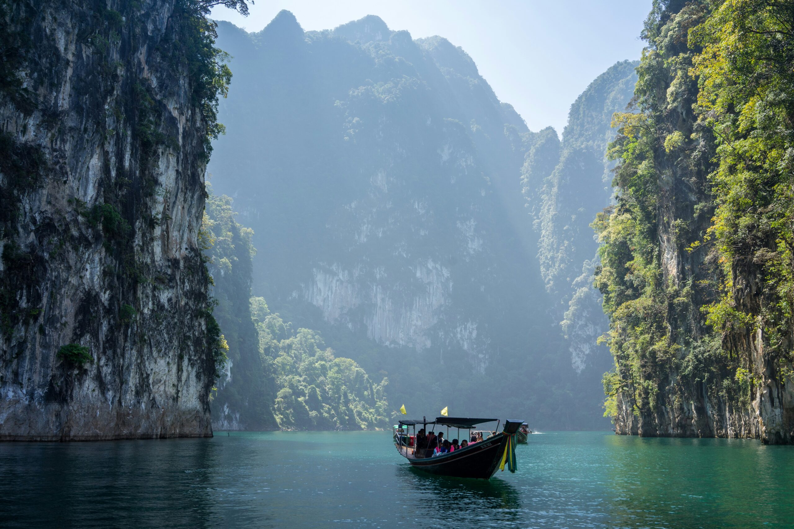 a person who retire in thailand on a boat floating in a gauge