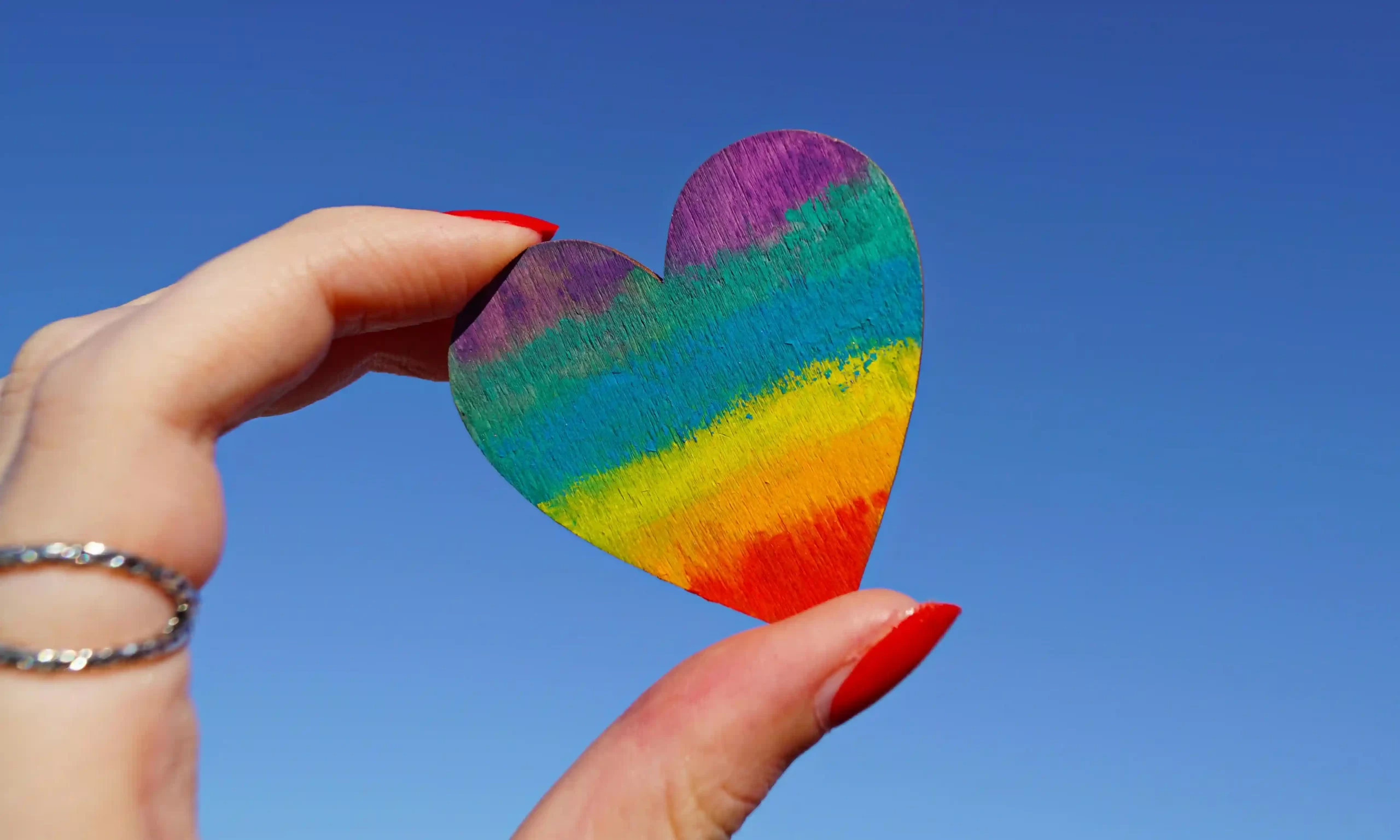 two fingers holding a heart celebrating same sex marriage in thailand