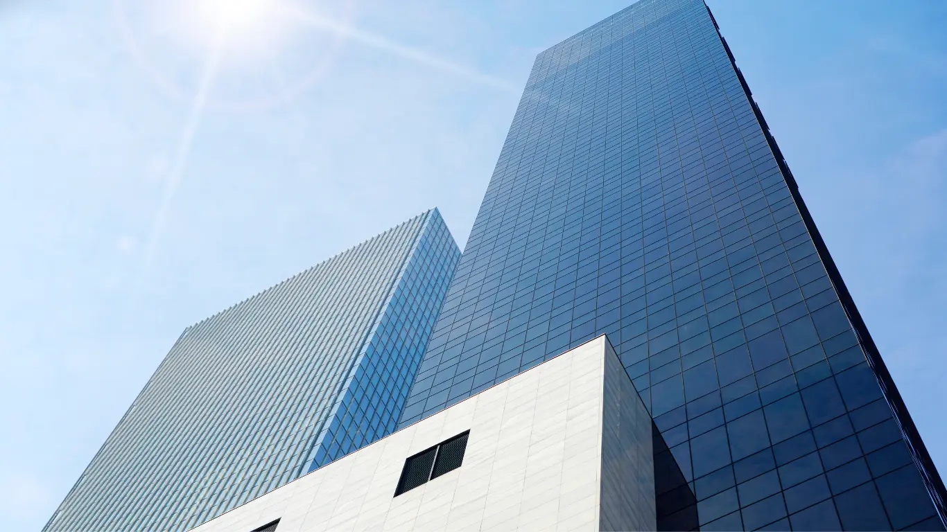 two buildings with blue sky in background representing an office for changing company address