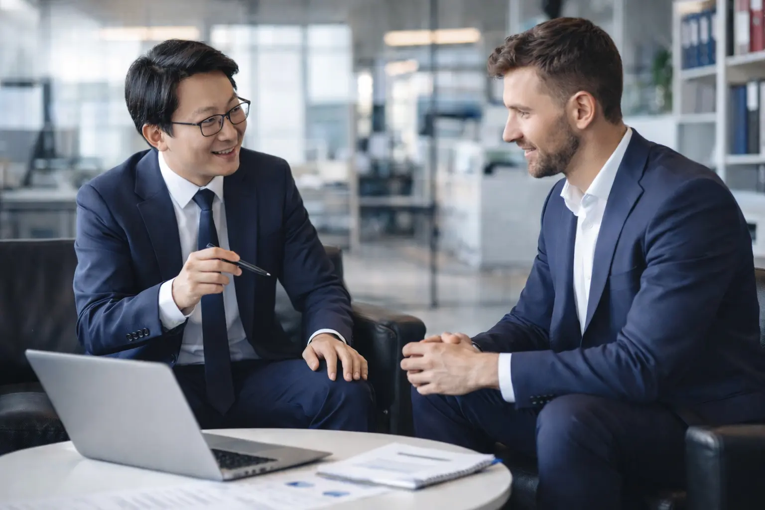 an accountant and business man discussing thailand company tax in a modern law office